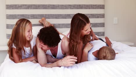 happy family on bed