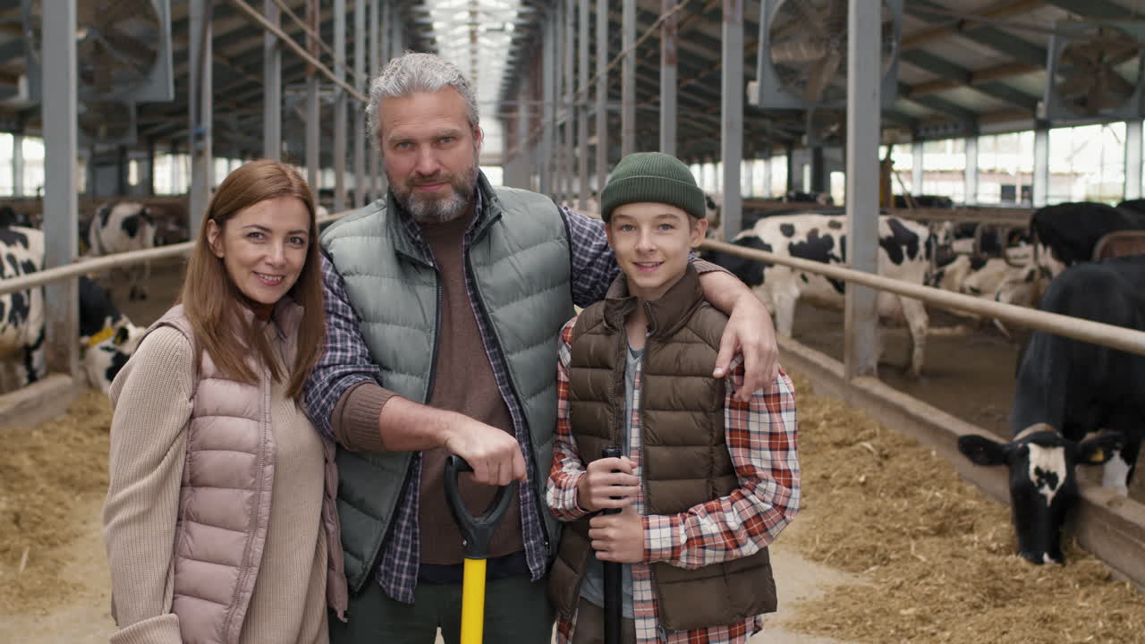 Happy Family of Three Posing at Dairy Farm