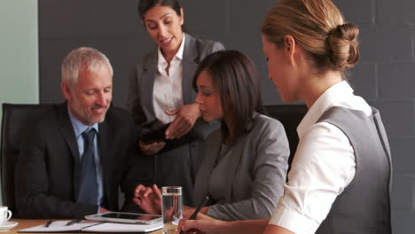 Business-people-working-together-with-tablet