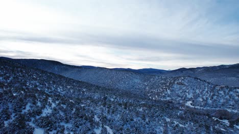 Drone-flying-over-top-of-snow-covered-desert-in-Northern-New-Mexico