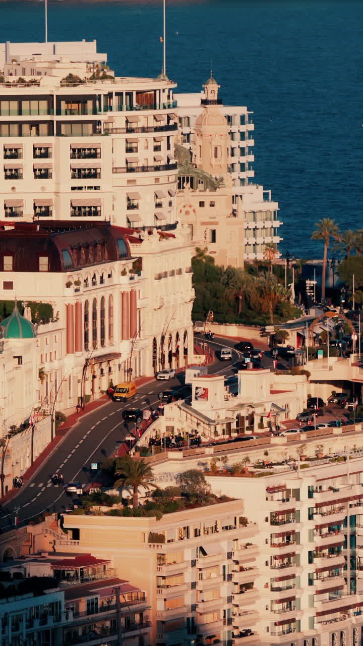 Distant view of cars moving through Monte Carlo, Monaco. Vertical