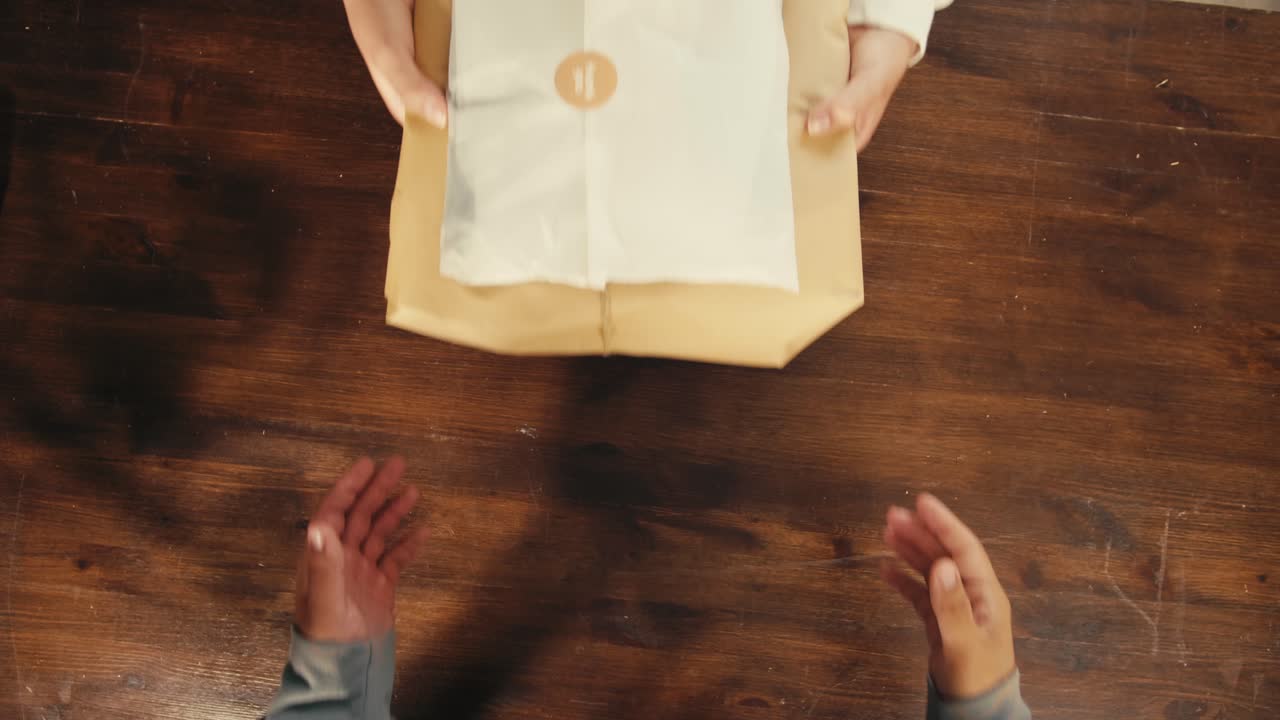 E-commerce storage shop, woman packing goods and clothes for second hand delivery market, dedicated Packaging and Shipping Workspace with Supplies and Technology for efficiency, online sales.