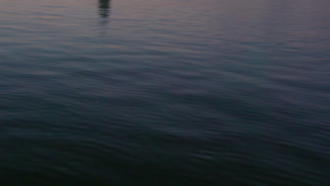 slow-mo, of water in the evening, pink and blue