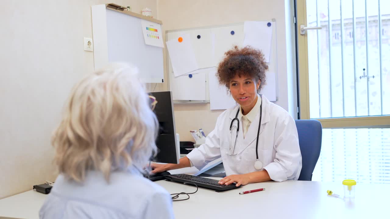 Doctor consulting with patient in clinic office