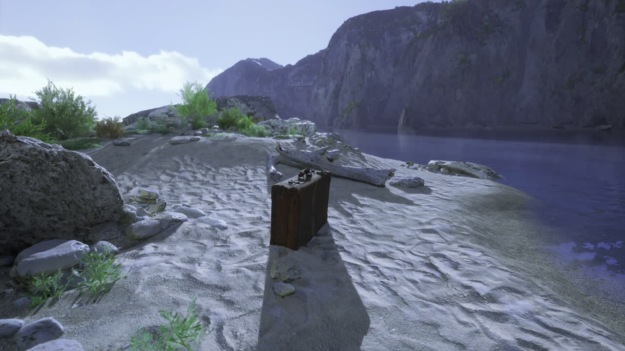 Abandoned chest on the sandy shore near the rocky mountains during daylight