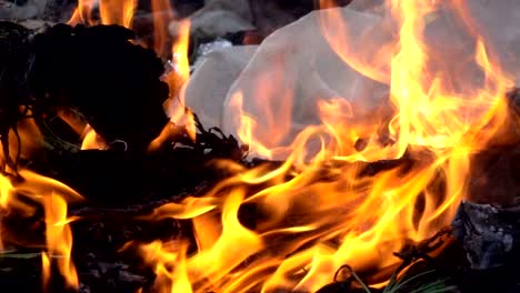 fire slow motion burning on garbage pile to air pollution