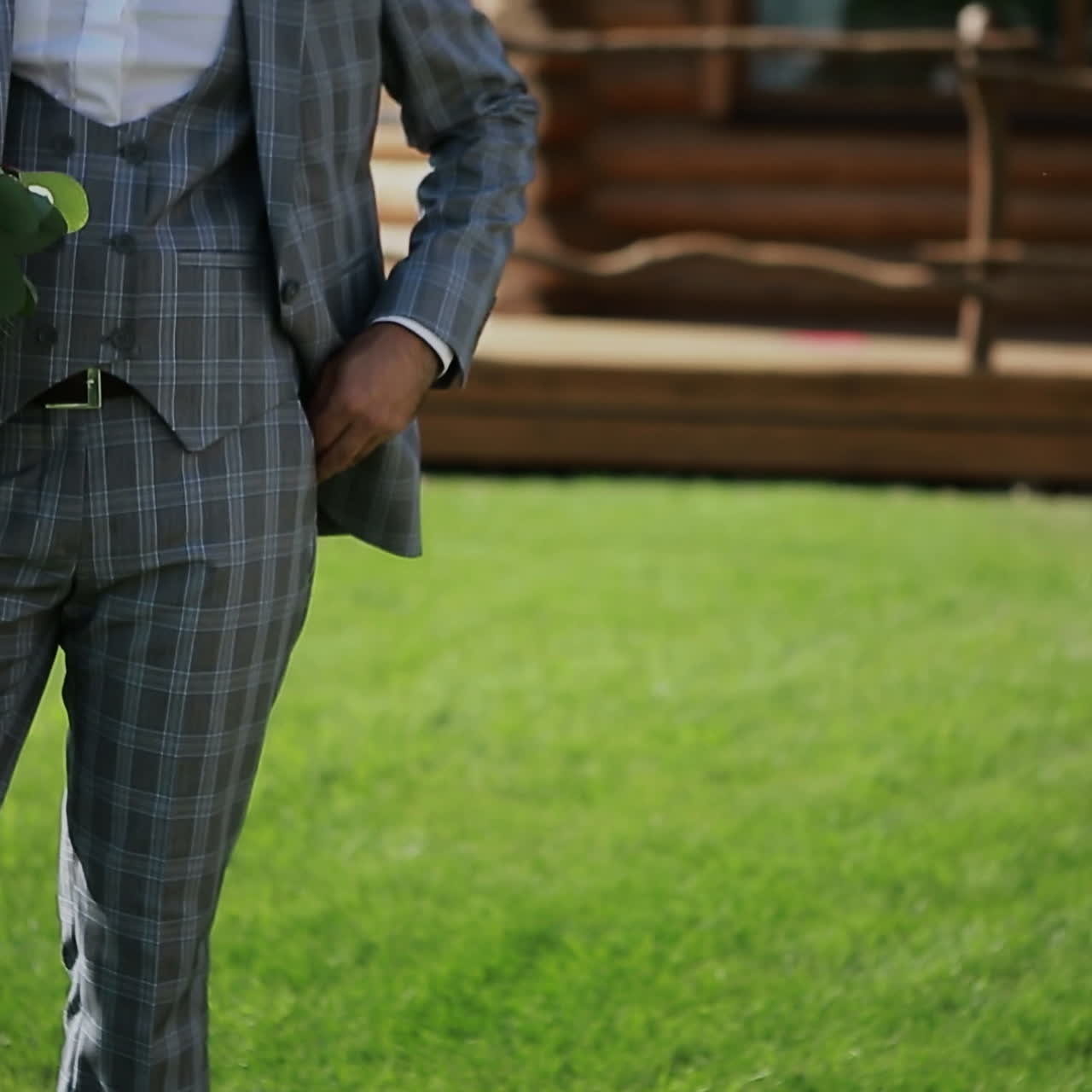 Wedding bouquet with beautiful flowers in the hands of the groom Square video