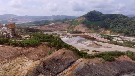polluted water in large gold mine, gravel quarry, aerial forward, dominican republic