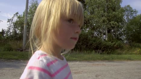 close up of cute young summer girl with eyes focused on something, interested