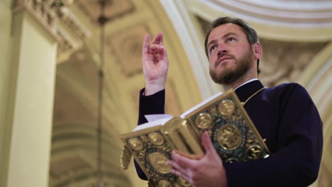 priest holding holy book