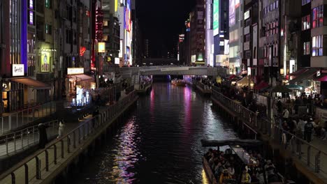 boat journey through a brightly lit city canal