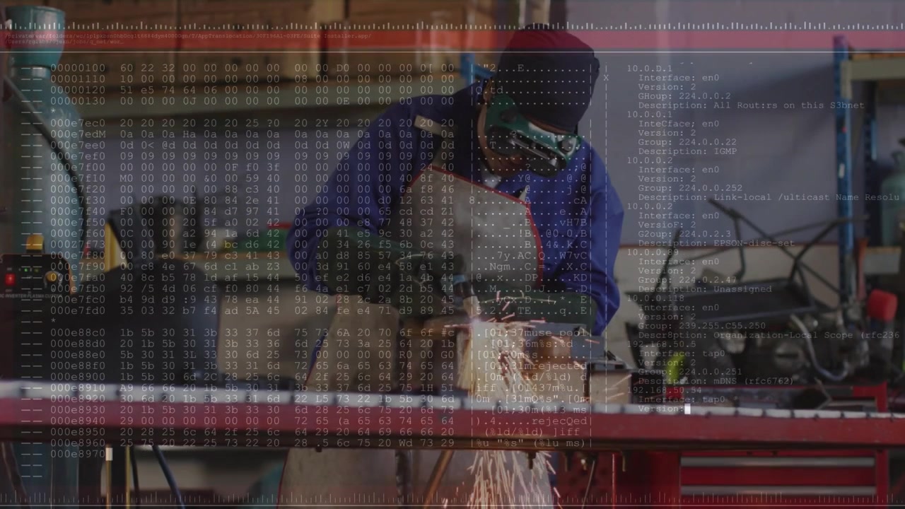Metal fabricator clamping metal, grinding with angle grinder, sparks erupting, hex code scrolling