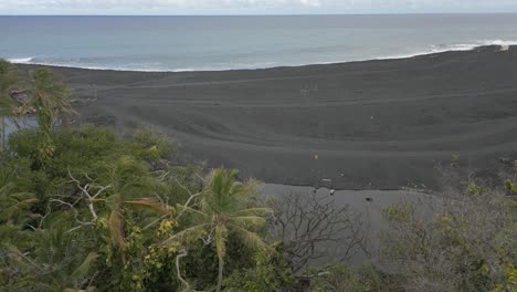 Rotating-aerial:-Volcanic-ash-at-Pohoiki-Bay-Hot-Springs-on-Hawaii