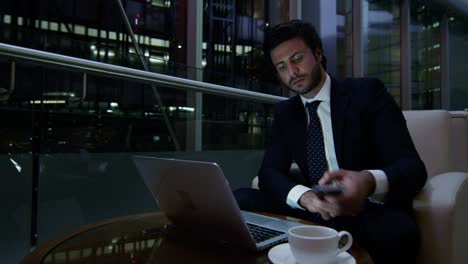 middle eastern businessman working with laptop smart phone