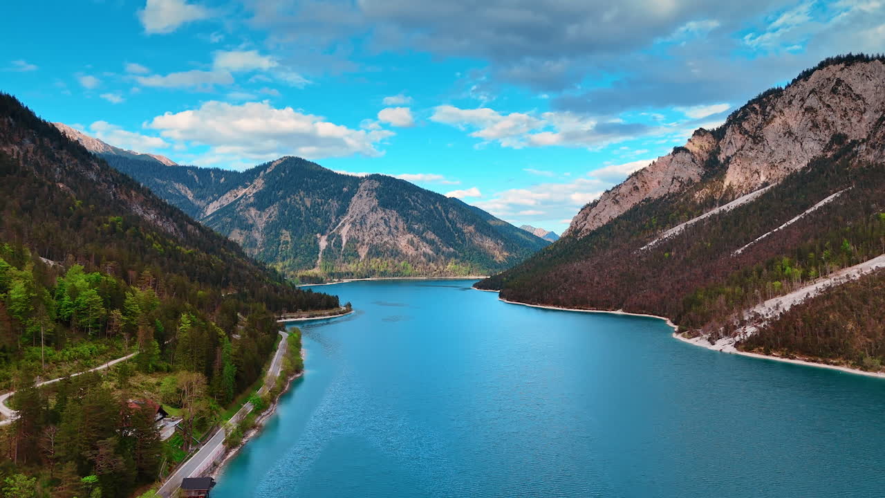 Peaceful waterscape of Plansee lake located among the spectacular mountains. Amazing nature of Tyrol, Austria.