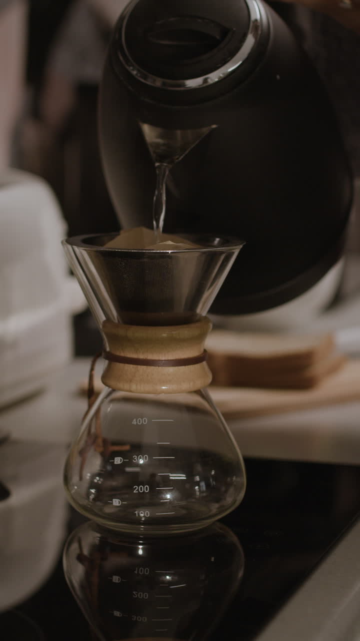 Pouring Coffee with a Kettle and Pour Over