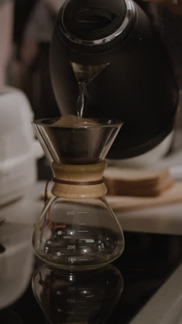 pouring coffee with a kettle and pour over