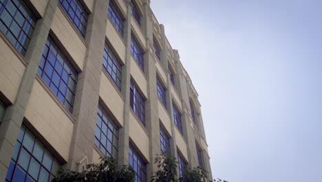 modern building exterior with trees and blue sky