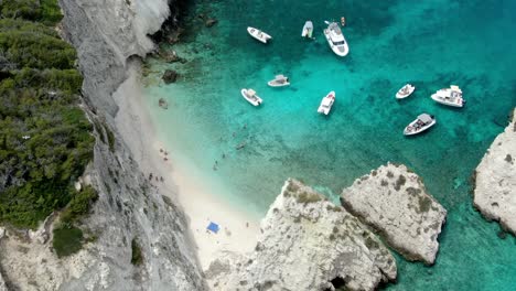 there are trees along the hillside of the italian island of tremiti, which has a white sand beach and stunning, clear waters of the adriatic sea