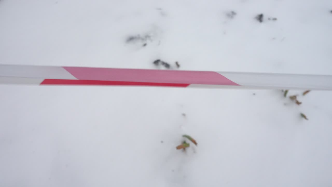 Red white tape. Shooting in the winter