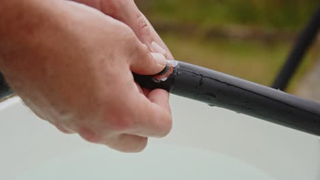 rubbing on rubber repair patch on punctured bicycle tire