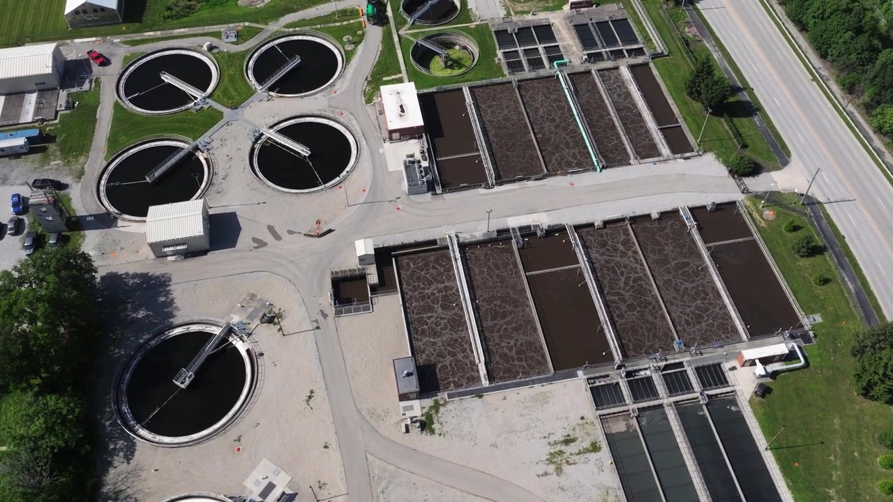 Aeration Basins and Clarifiers at Water Treatment Facility. Aerial Parallax Shot