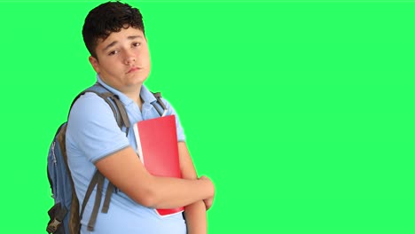 sad schoolboy at green screen background 1