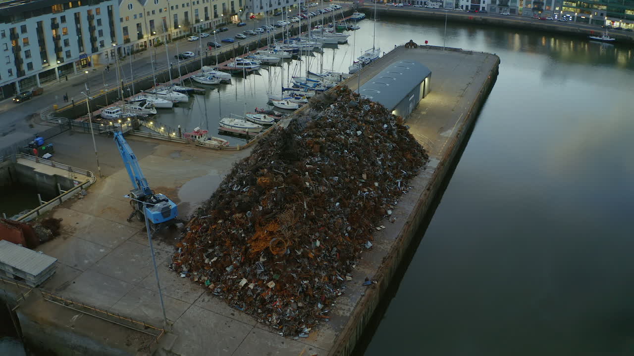 Aerial orbit of a massive scrap pile at Galway docks