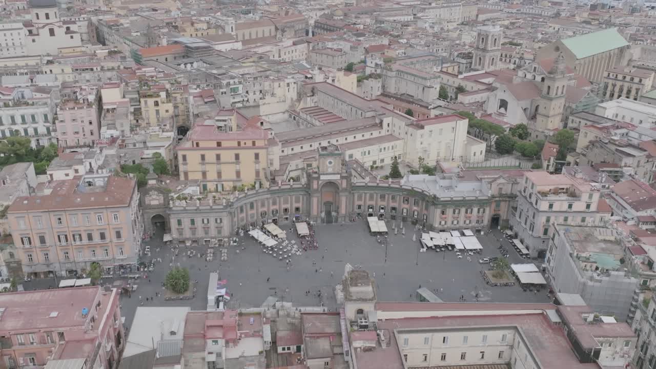Slow aerial flyover footage of Piazza Dante in Naples, Italy.