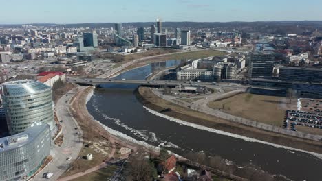 aerial: flying over river neris towards roundabout in vilnius