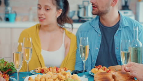 Group-of-people-clinking-during-the-dinner