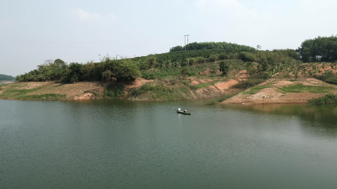 Fisherman in a boat on a lake