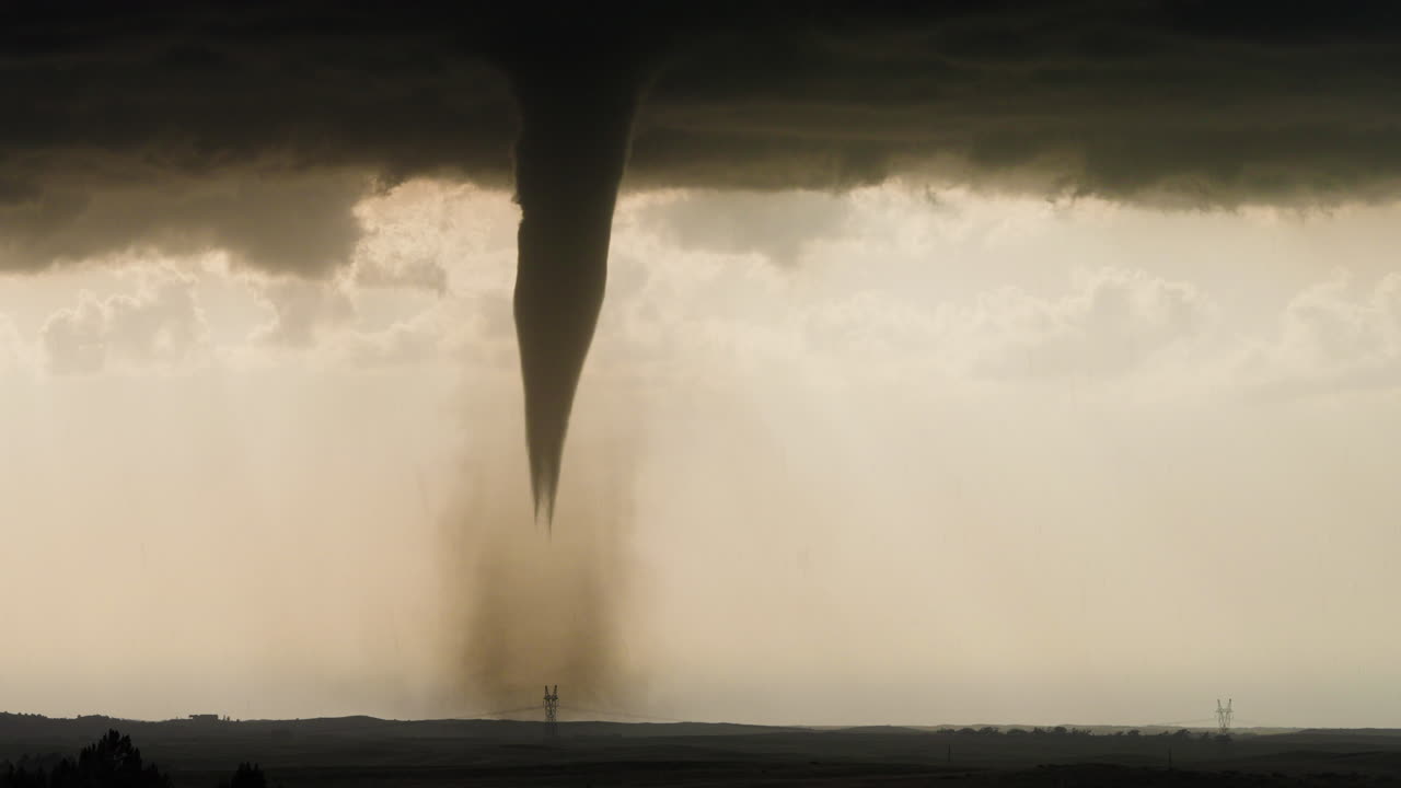 Large Tornado Captured at Sunset Under Beautiful Storm Skies
