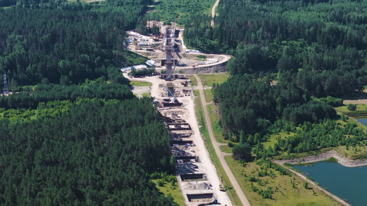 Rail Baltic railway construction project bridge site over Neris river, aerial view