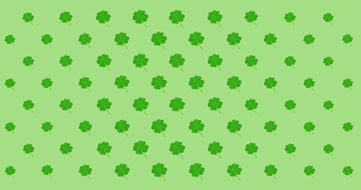 Animazione di file di foglie di trifoglio pulsanti su sfondo verde.