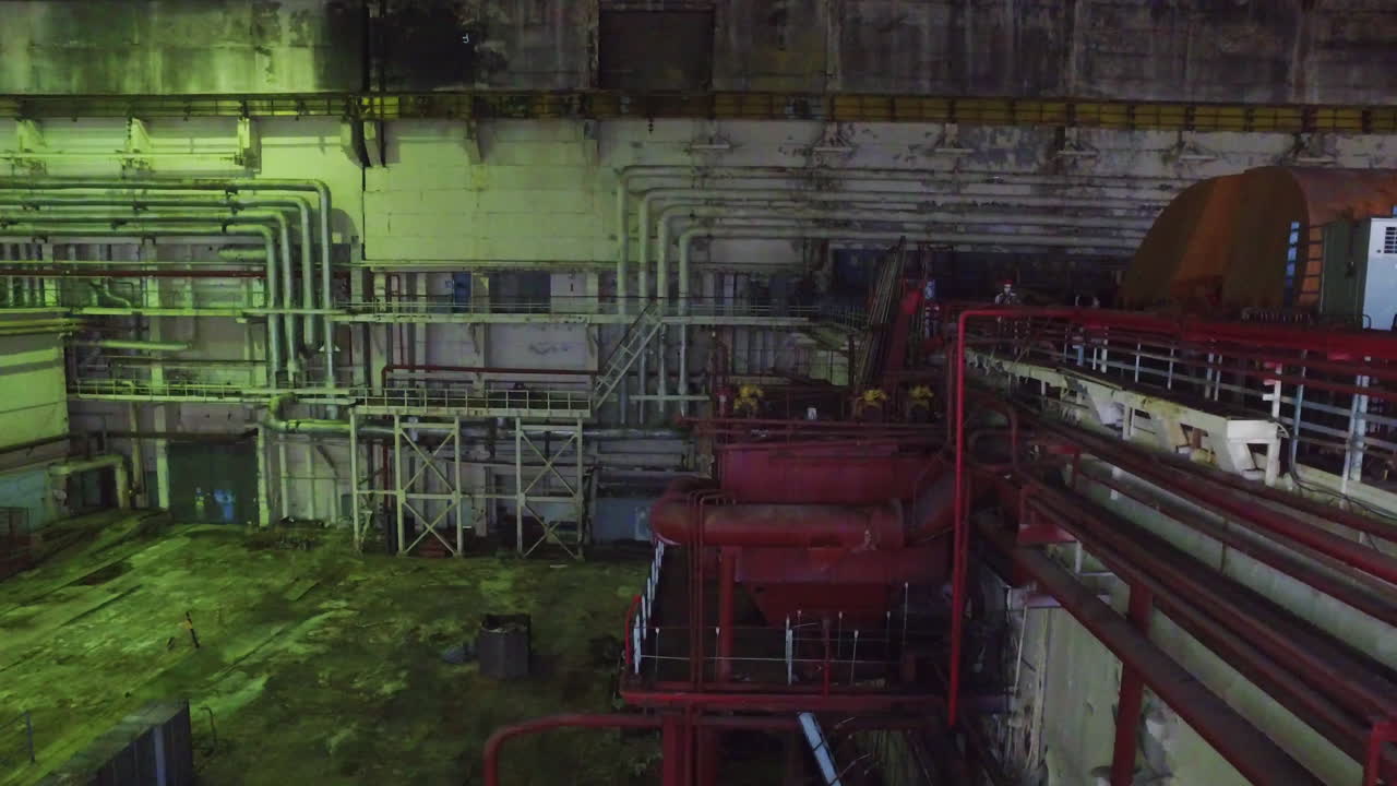 Aerial shot through abandoned Chernobyl nuclear reactor, Dimly lit warehouse. Pripyat, Ukraine