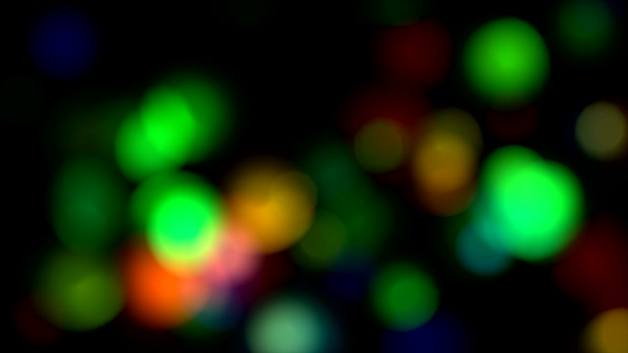 luces coloridas abstractas en desenfocado. bucle sin costuras