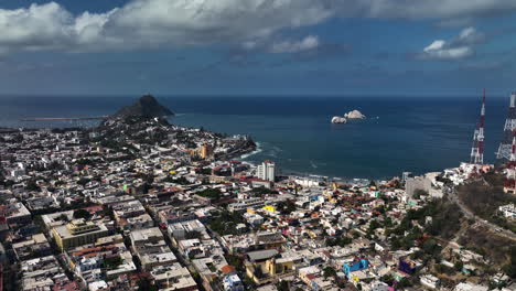 Aerial-view-over-the-cityscape,-toward-the-coast-of-Mazatlan,-Mexico