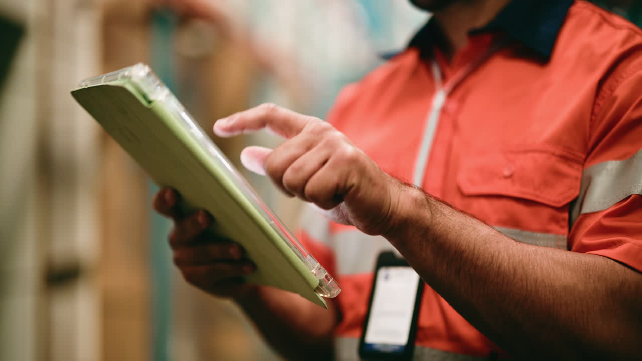 Industrial Worker Using Digital Tablet for Inventory Management