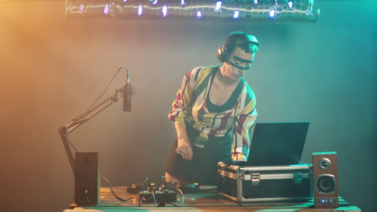 Young artist mixing with turntables on stage