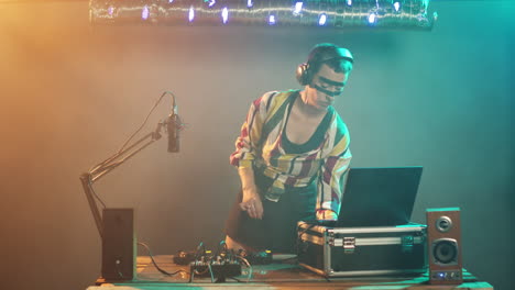 young artist mixing with turntables on stage