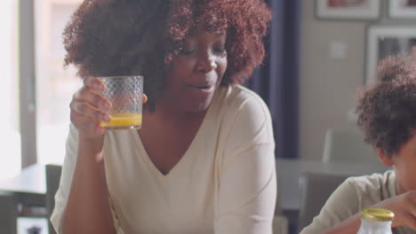 african american family chatting on breakfast at home