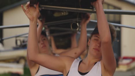 female rowing team training on a river