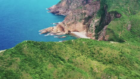 peaceful sai kung lush tropical island landscape edge aerial orbit left birdseye