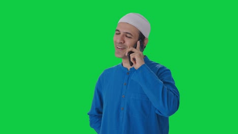 Happy-Muslim-man-talking-on-phone-Green-screen