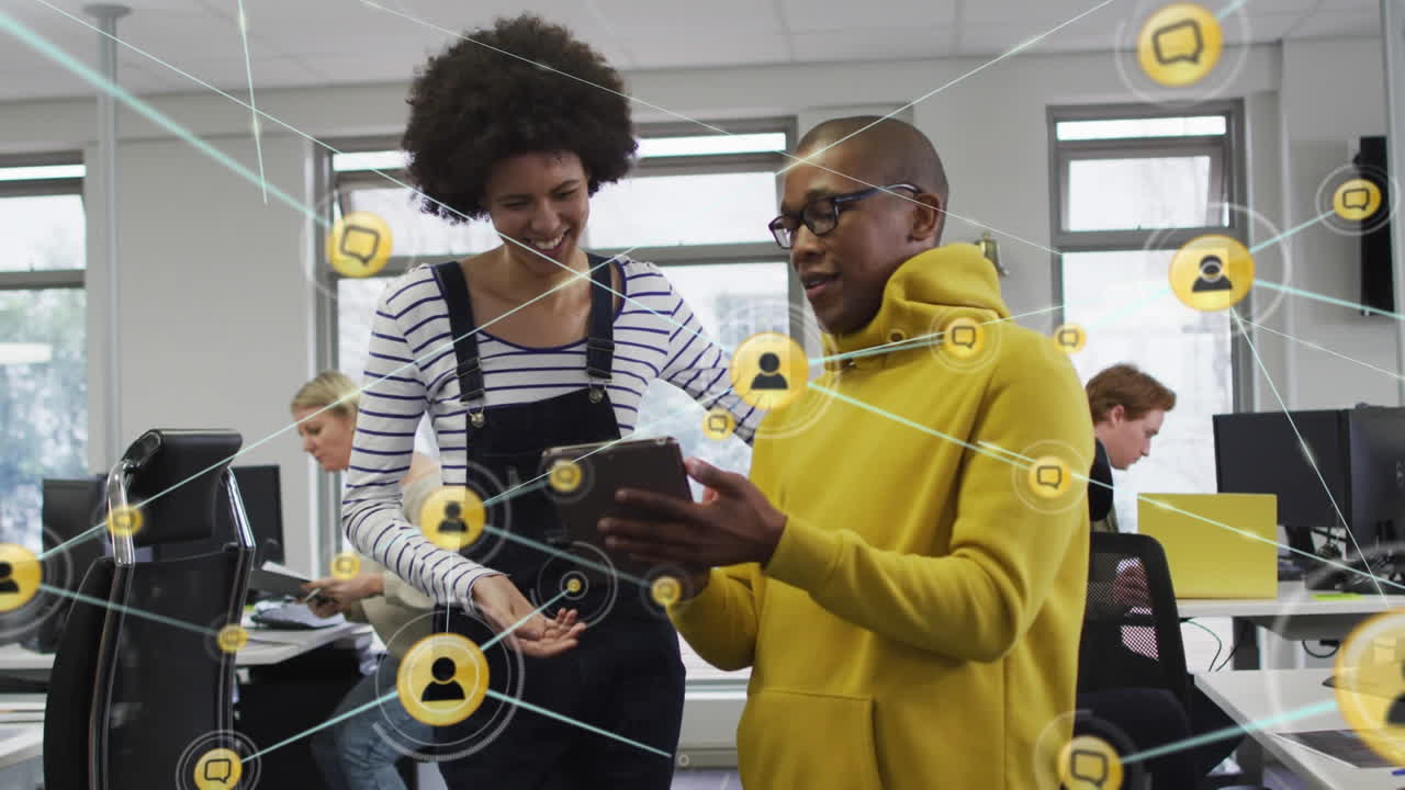 Animation of connections with icons over diverse business people in office
