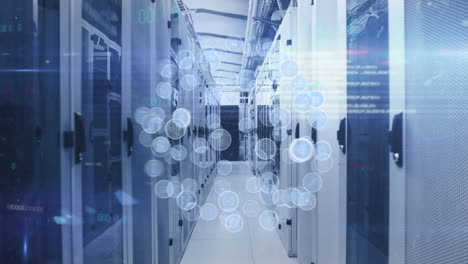 animation of globe of digital icons and light spot against computer server room