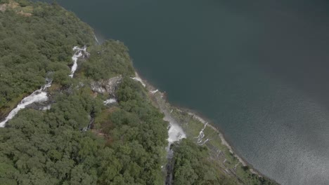 Aerial-top-view-of-seven-sisters-waterfall-with-green-forest-in-Geiranger,-Norway