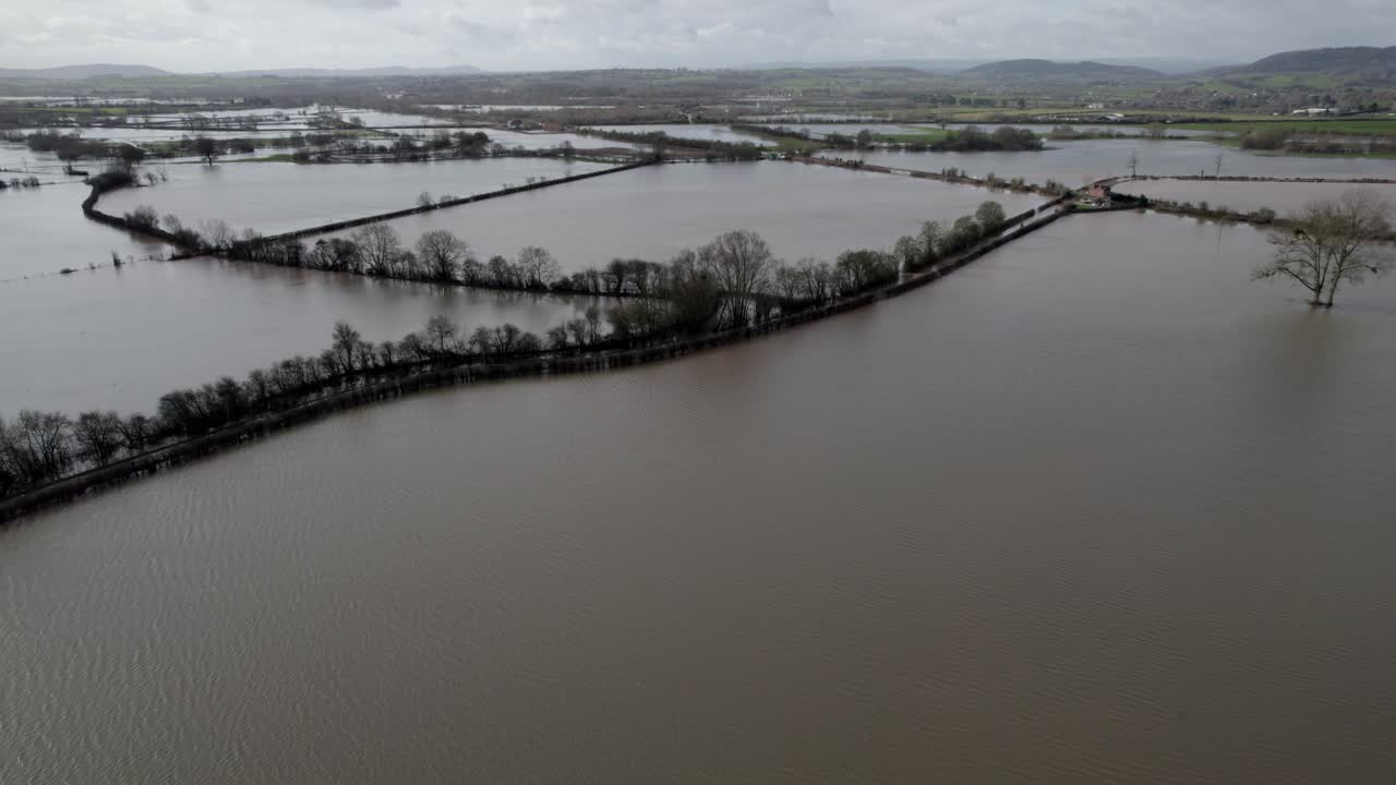 Flooded farm fields after heavy rain England aerial drone view