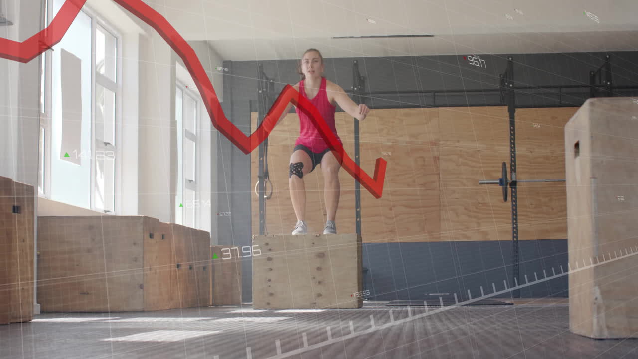 체육관에서 나무 상자에 서 있는 여자 위의 빨간 선 그래프 애니메이션